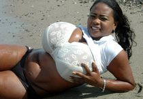 Miosotis rinse her huge black boobs in the sea