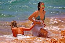 Shay Mitchell showing off her bikini body on a beach in Maui