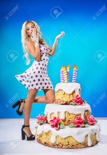 Sexy girl blowing a candle