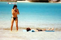 Penelope Cruz topless on a beach