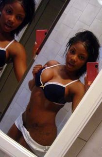 Big titted ebony cutie in front of mirror
