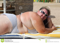 Overweight woman on beach stock image. Image of sand -