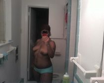 Very fat black gal posing naked on cam demonstrating her chubby body.